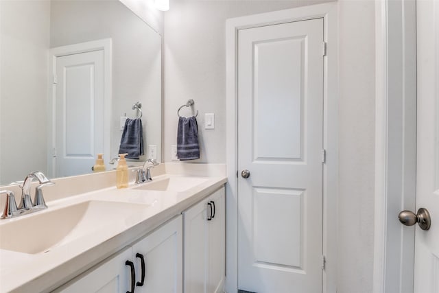 bathroom featuring double vanity