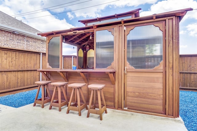view of patio / terrace featuring fence