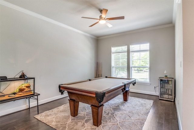recreation room featuring a ceiling fan, dark wood finished floors, ornamental molding, billiards, and baseboards