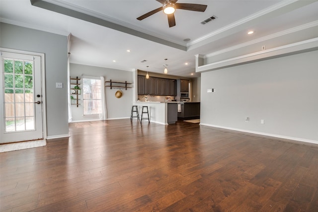6308 Bittersweet Dr, Arlington, TX 76001 - unfurnished living room with ceiling fan, ornamental molding, dark wood-style floors, recessed lighting, and a tray ceiling