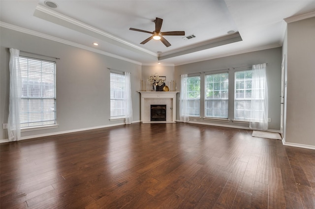 6308 Bittersweet Dr, Arlington, TX 76001 - unfurnished living room featuring a raised ceiling, ceiling fan, dark wood-style flooring, a fireplace, and ornamental molding