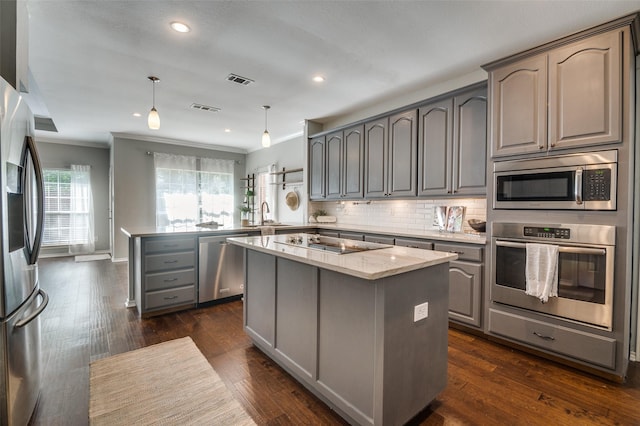 6308 Bittersweet Dr, Arlington, TX 76001 - kitchen featuring stainless steel appliances, gray cabinets, a peninsula, crown molding, and a kitchen island