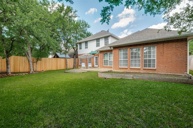 6308 Bittersweet Dr, Arlington, TX 76001 - rear view of property with a patio area, brick siding, a fenced backyard, and a shingled roof