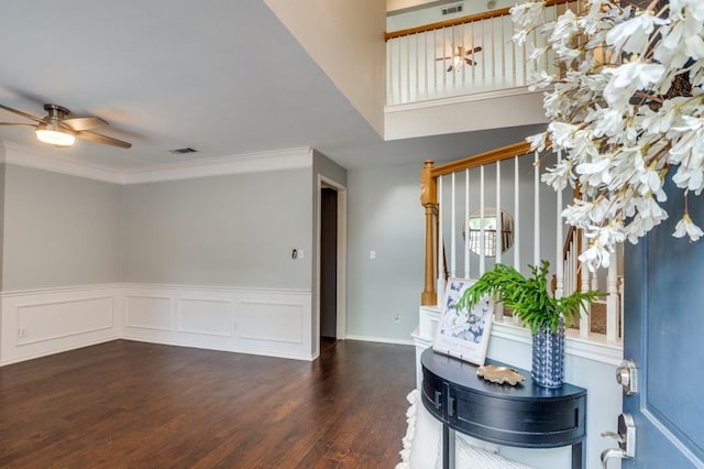 6308 Bittersweet Dr, Arlington, TX 76001 - entryway with wood finished floors, ceiling fan, crown molding, and a wainscoted wall