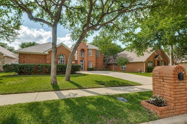 6308 Bittersweet Dr, Arlington, TX 76001 - traditional-style house with brick siding, a front lawn, driveway, and roof with shingles