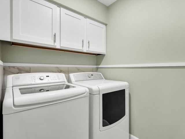 2834 Sunny Hill Ln, Farmers Branch, TX 75234 - laundry room featuring cabinet space and separate washer and dryer
