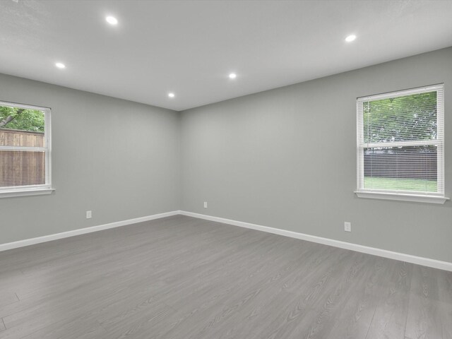 2834 Sunny Hill Ln, Farmers Branch, TX 75234 - empty room featuring dark wood-type flooring, baseboards, and recessed lighting