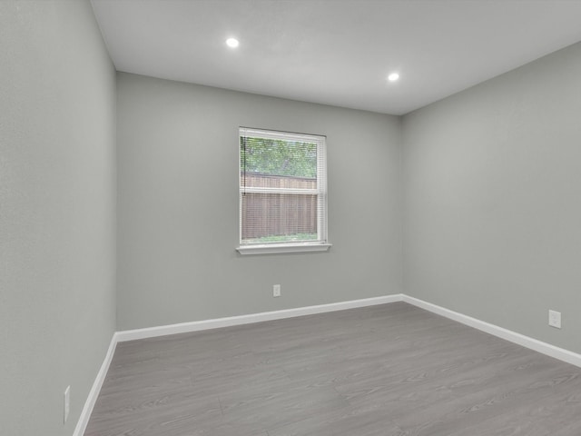 2834 Sunny Hill Ln, Farmers Branch, TX 75234 - unfurnished room with wood finished floors, baseboards, and recessed lighting
