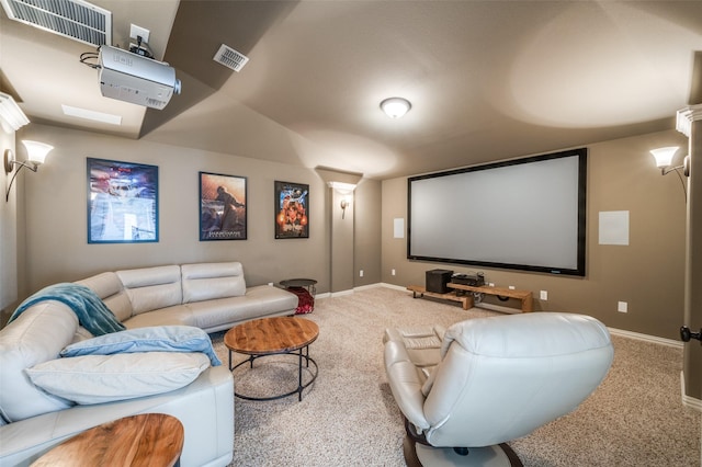 carpeted home theater with baseboards and lofted ceiling