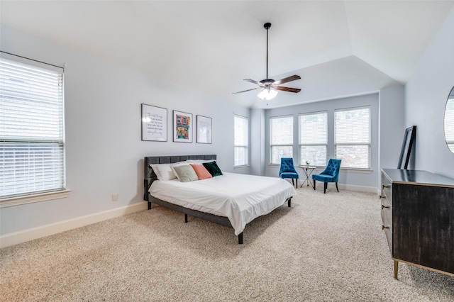 carpeted bedroom featuring baseboards and a ceiling fan