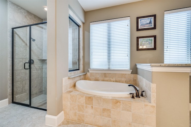 full bathroom with a shower stall, a garden tub, and tile patterned floors