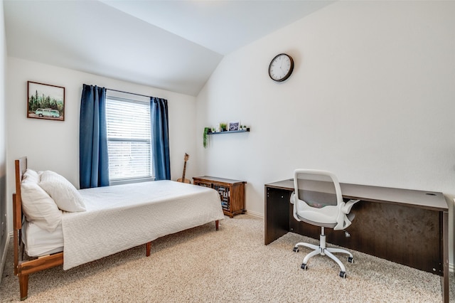 carpeted bedroom featuring vaulted ceiling