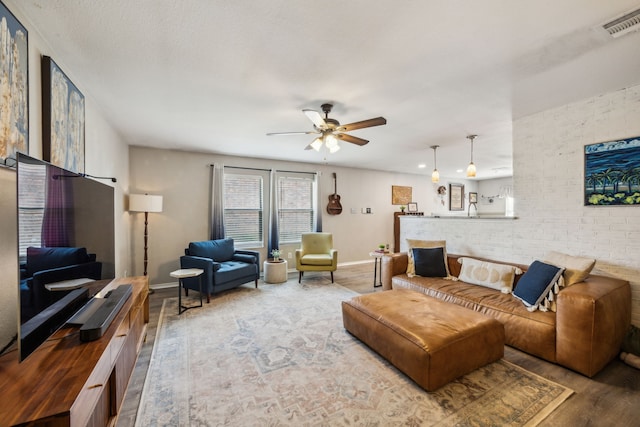 605 Preston Dr, Royse City, TX 75189 - living area featuring wood finished floors, ceiling fan, and baseboards