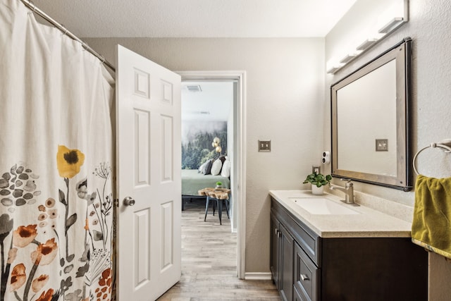 605 Preston Dr, Royse City, TX 75189 - full bathroom with vanity, wood finished floors, and a shower with curtain