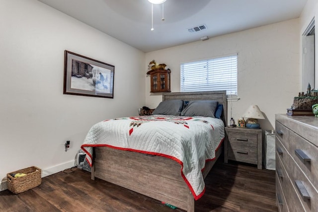 2818 Ashglen Dr, Garland, TX 75043 - bedroom with dark wood-style flooring, a ceiling fan, and baseboards