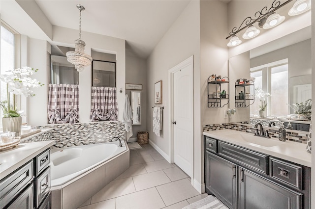 1212 Teton Dr, Burleson, TX 76028 - bathroom featuring a chandelier, plenty of natural light, a bath, and vanity