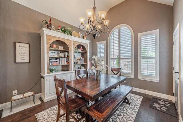 1212 Teton Dr, Burleson, TX 76028 - dining space featuring a chandelier, dark wood-type flooring, baseboards, and lofted ceiling