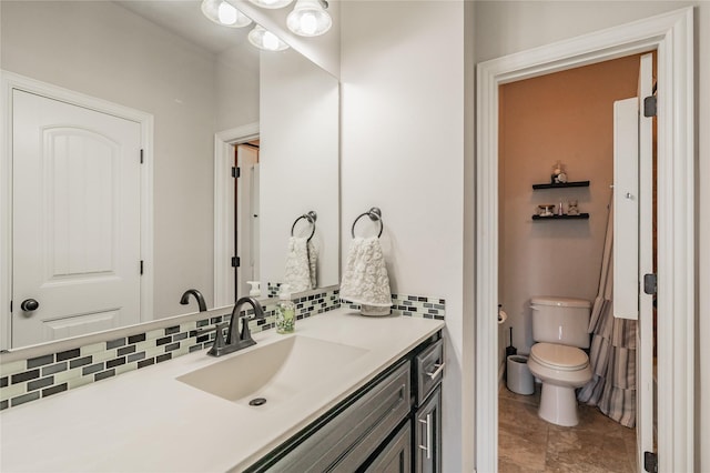 1212 Teton Dr, Burleson, TX 76028 - bathroom featuring toilet, tasteful backsplash, vanity, and tile patterned flooring