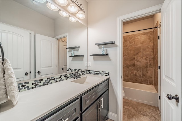 1212 Teton Dr, Burleson, TX 76028 - bathroom featuring toilet, vanity, washtub / shower combination, and backsplash