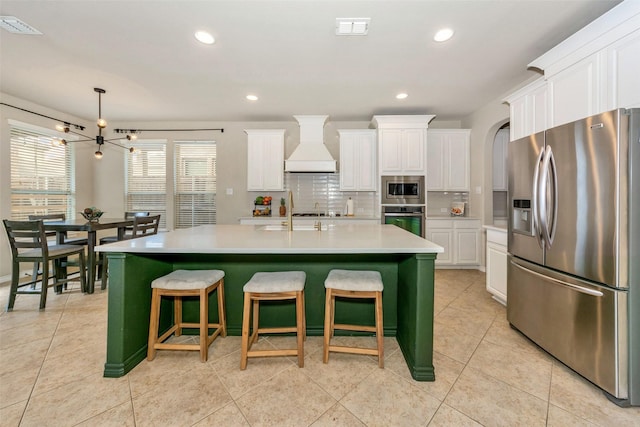 8625 Tribute Ln, Fort Worth, TX 76131 - kitchen featuring stainless steel appliances, premium range hood, white cabinetry, and recessed lighting