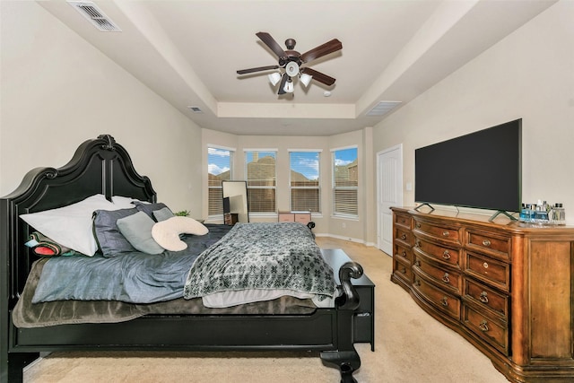 8625 Tribute Ln, Fort Worth, TX 76131 - bedroom with a tray ceiling, light carpet, and a ceiling fan