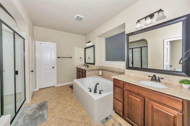 8625 Tribute Ln, Fort Worth, TX 76131 - bathroom with a stall shower, tile patterned floors, a garden tub, and vanity