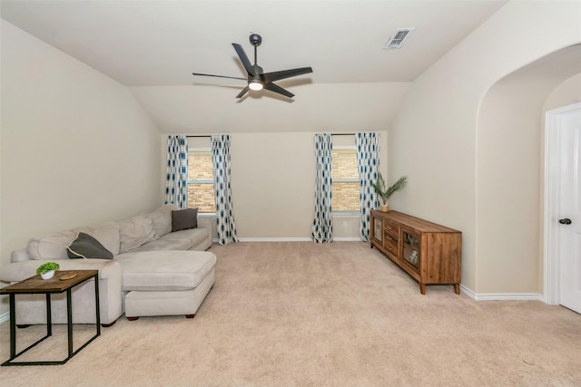 8625 Tribute Ln, Fort Worth, TX 76131 - carpeted living area featuring lofted ceiling, ceiling fan, arched walkways, and baseboards