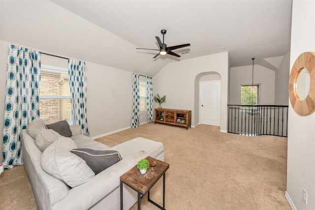 8625 Tribute Ln, Fort Worth, TX 76131 - living room with ceiling fan, vaulted ceiling, light carpet, and baseboards