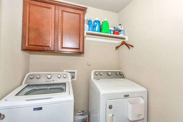 8625 Tribute Ln, Fort Worth, TX 76131 - clothes washing area with washer and dryer and cabinet space