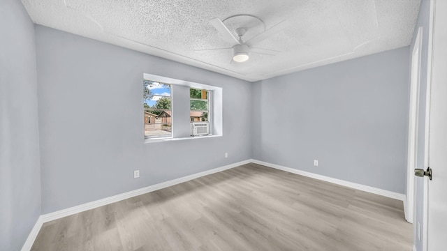 2017 Moline Dr, Haltom City, TX 76117 - unfurnished room with a textured ceiling, wood finished floors, ceiling fan, and baseboards