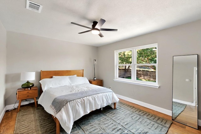 53 Devonshire Dr, Bedford, TX 76021 - bedroom featuring wood finished floors, baseboards, and a ceiling fan