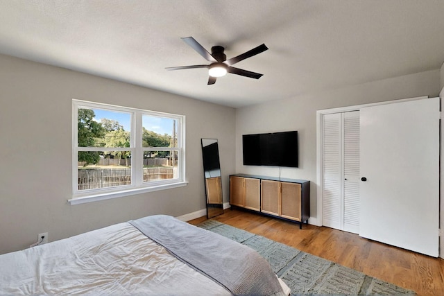 53 Devonshire Dr, Bedford, TX 76021 - bedroom featuring wood finished floors, baseboards, a closet, and ceiling fan