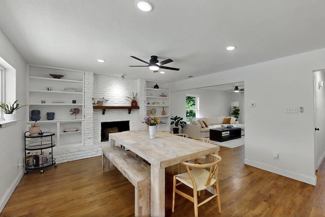 53 Devonshire Dr, Bedford, TX 76021 - dining area with a ceiling fan, wood finished floors, baseboards, recessed lighting, and a fireplace