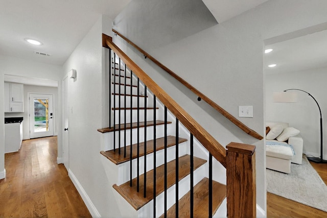 53 Devonshire Dr, Bedford, TX 76021 - staircase featuring wood finished floors, recessed lighting, and baseboards