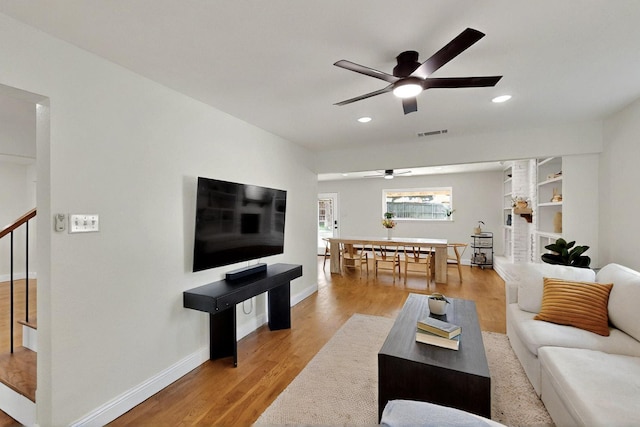 53 Devonshire Dr, Bedford, TX 76021 - living area featuring ceiling fan, wood finished floors, baseboards, recessed lighting, and stairway
