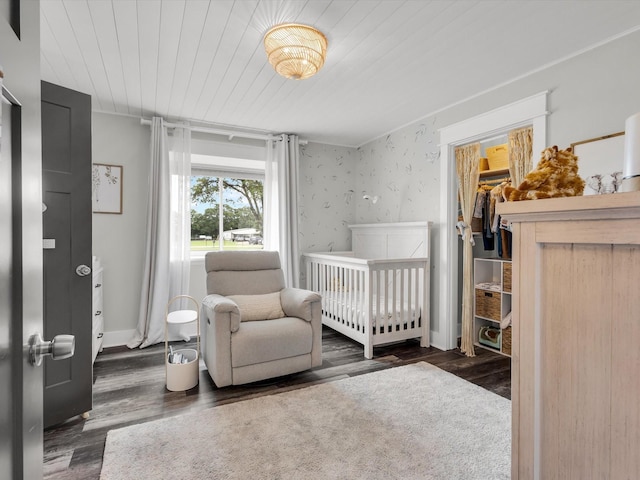 325 Beasley Rd, Combine, TX 75159 - bedroom featuring wood finished floors, wood ceiling, a crib, and baseboards