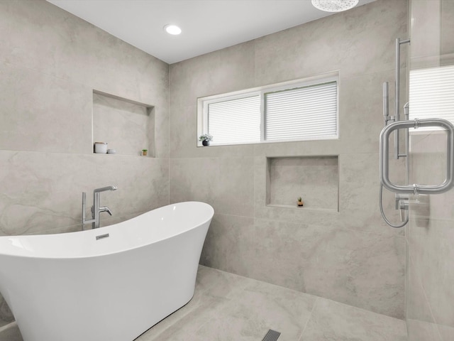 325 Beasley Rd, Combine, TX 75159 - bathroom featuring a stall shower and a freestanding bath