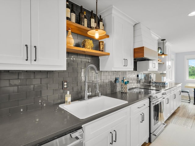 325 Beasley Rd, Combine, TX 75159 - kitchen with open shelves, appliances with stainless steel finishes, a sink, and backsplash