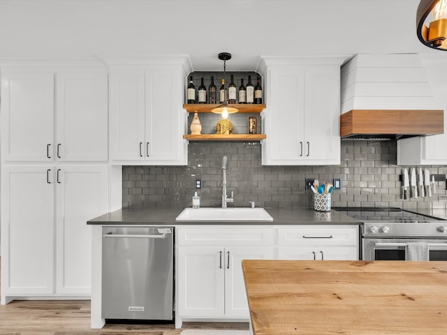 325 Beasley Rd, Combine, TX 75159 - kitchen with a sink, stainless steel appliances, open shelves, and tasteful backsplash
