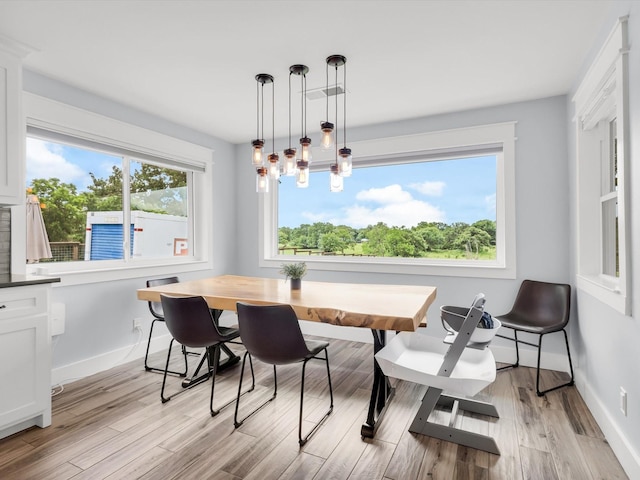 325 Beasley Rd, Combine, TX 75159 - dining area featuring baseboards and light wood-style floors