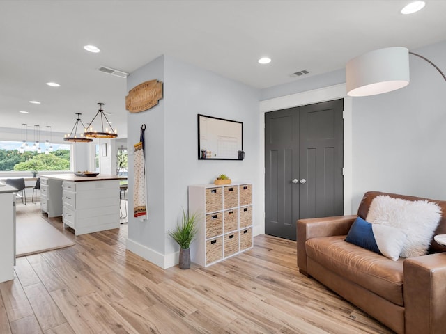 325 Beasley Rd, Combine, TX 75159 - living area with light wood-style floors, recessed lighting, baseboards, and a chandelier