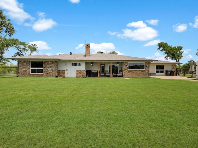 325 Beasley Rd, Combine, TX 75159 - back of property featuring a patio area, a lawn, and a chimney