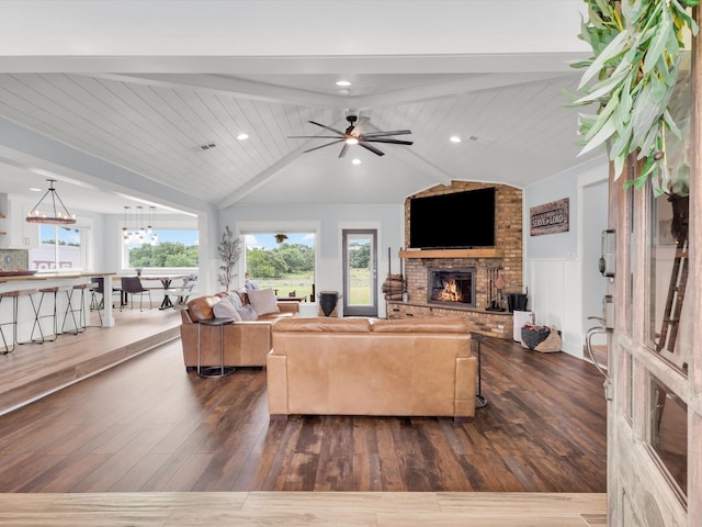325 Beasley Rd, Combine, TX 75159 - living room featuring a fireplace, wood finished floors, a ceiling fan, and a chandelier