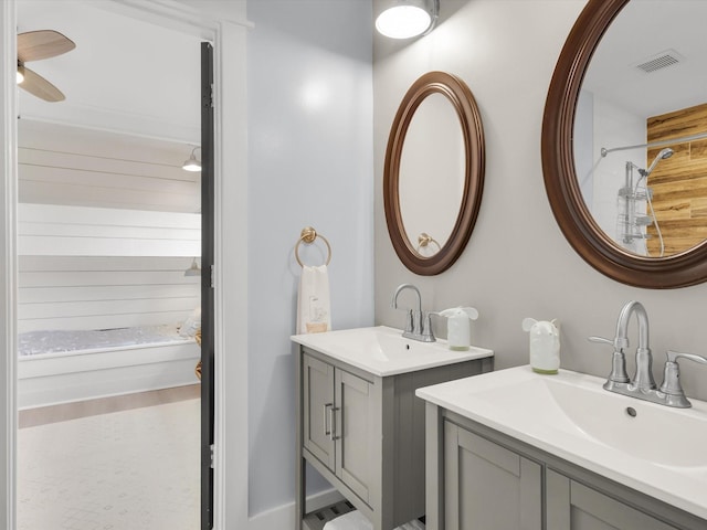 325 Beasley Rd, Combine, TX 75159 - bathroom featuring two vanities, a shower, and a ceiling fan