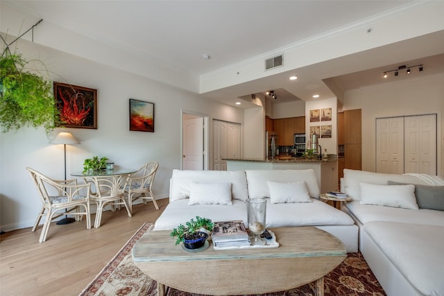 3225 Turtle Creek Blvd Unit 326, Dallas, TX 75219 - living area with crown molding, light wood finished floors, baseboards, and recessed lighting