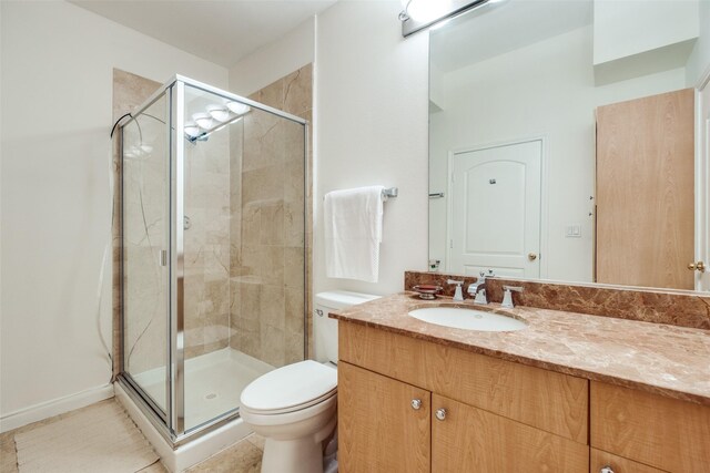 3225 Turtle Creek Blvd Unit 326, Dallas, TX 75219 - bathroom featuring a stall shower, toilet, and vanity
