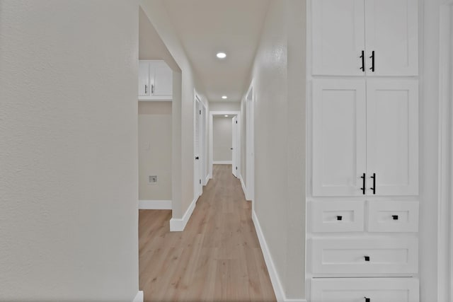 1146 Norwood Dr, Hurst, TX 76053 - hall with light wood-type flooring, recessed lighting, baseboards, and a textured wall