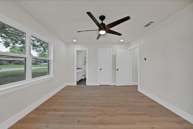 1146 Norwood Dr, Hurst, TX 76053 - unfurnished bedroom featuring baseboards, recessed lighting, light wood-style flooring, connected bathroom, and a ceiling fan