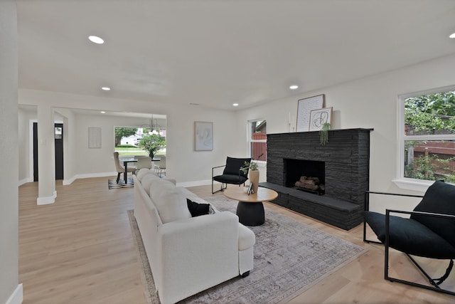 1146 Norwood Dr, Hurst, TX 76053 - living room with plenty of natural light, a fireplace, recessed lighting, and light wood-style floors