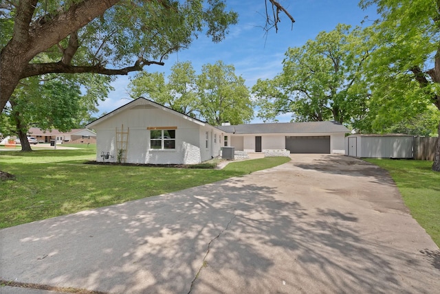 1146 Norwood Dr, Hurst, TX 76053 - view of front of house with driveway, central air condition unit, a garage, and brick siding
